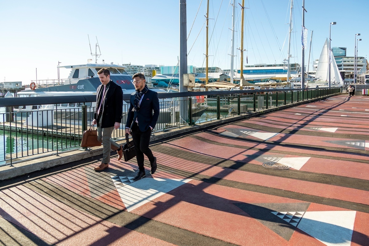 Two people walking in Auckland