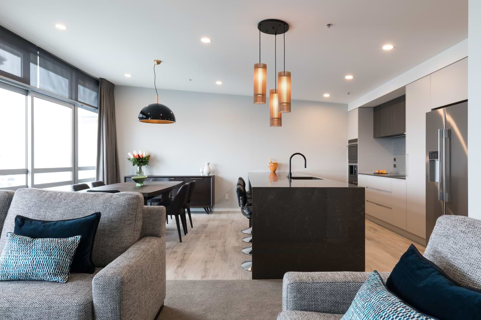 Wide shot of kitchen and dining area. 