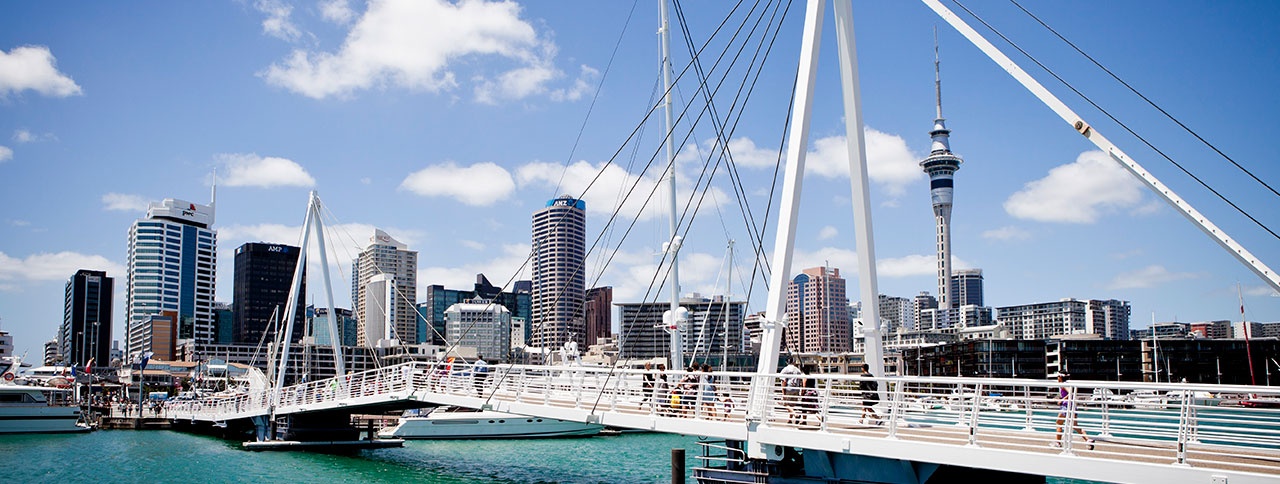 Auckland city skyline and Viaduct Harbour and bridge on a sunny day