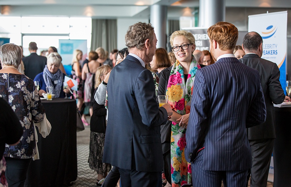 Group of three networking at an event