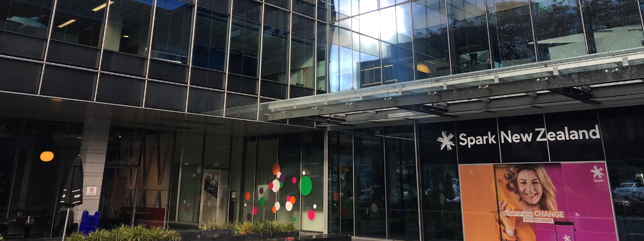 Image shows entrance to Spark building in Auckland