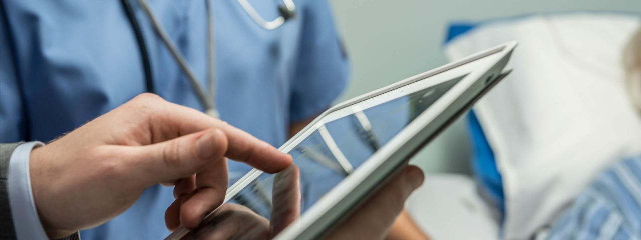 Doctors looking at tablet (credit: NZ Story)