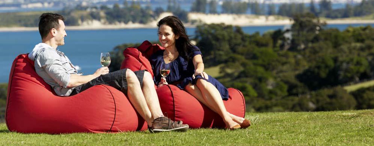 Couple sitting on bean bags with city in the background (credit: ATEED / Chris McLennan)
