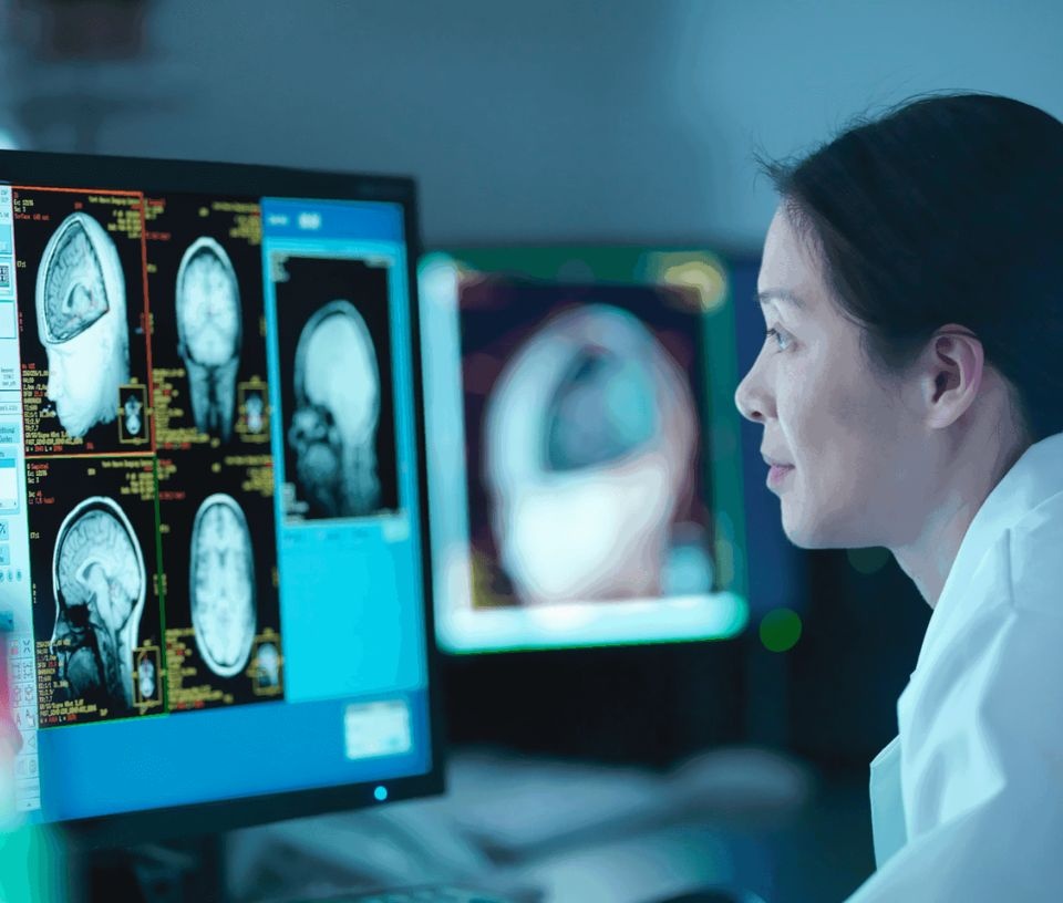 Tech Auckland - Culture - Woman looking at brain scans on computer