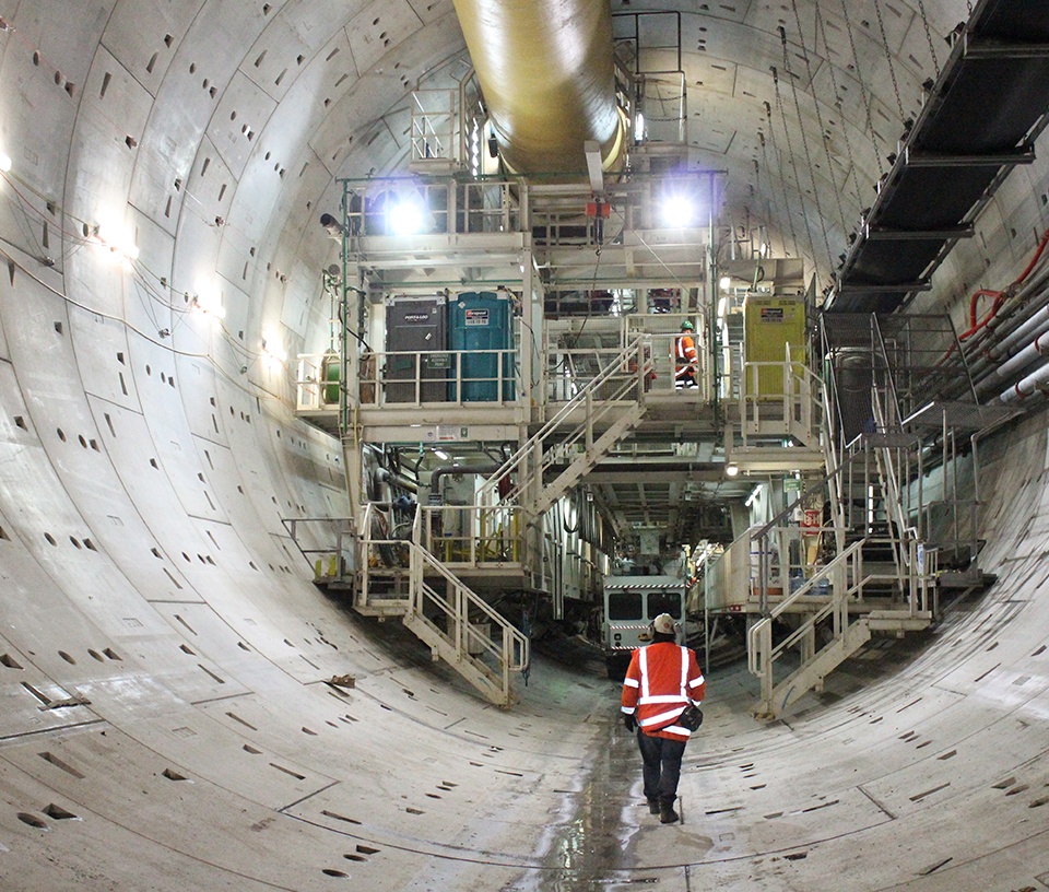 Man walking inside the City Rail Link tunnel