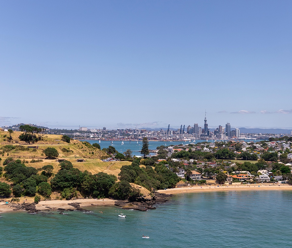 View of hill with Auckland city in the distance