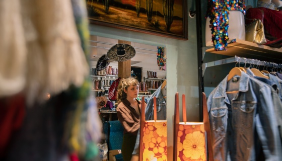 A lady shopping vintage clothes