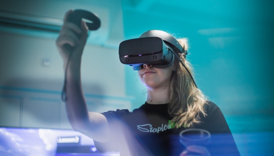 Woman demonstrating virtual reality machine