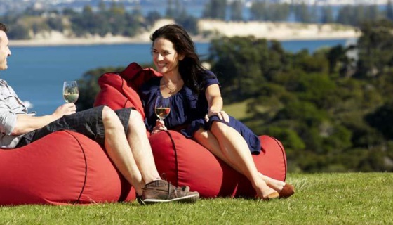 Couple sitting on bean bags with city in the background (credit: ATEED / Chris McLennan)