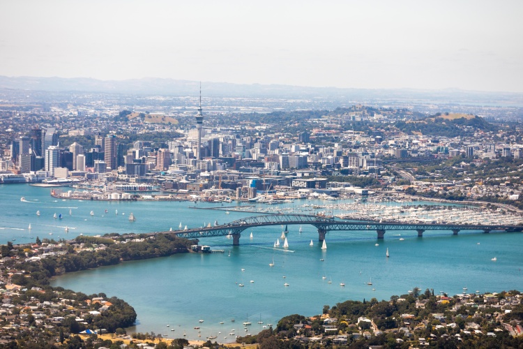 Aerial View of Auckland City featuring ocean and Harbour Bridge