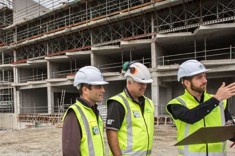 Three construction workers on site